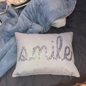 Gray sequined smile pillow